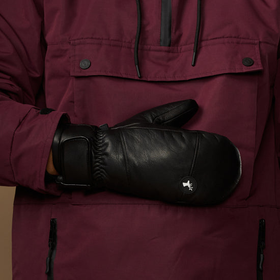 Black leather mitten with a gathered wrist cuff and small logo patch.