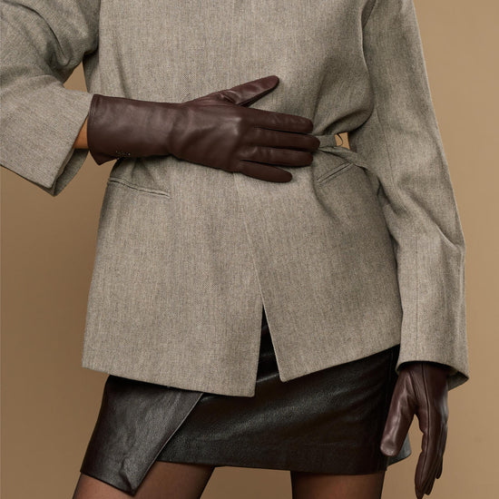 Long dark brown leather gloves with extended cuff edge