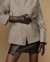 Long dark brown leather gloves with extended cuff edge