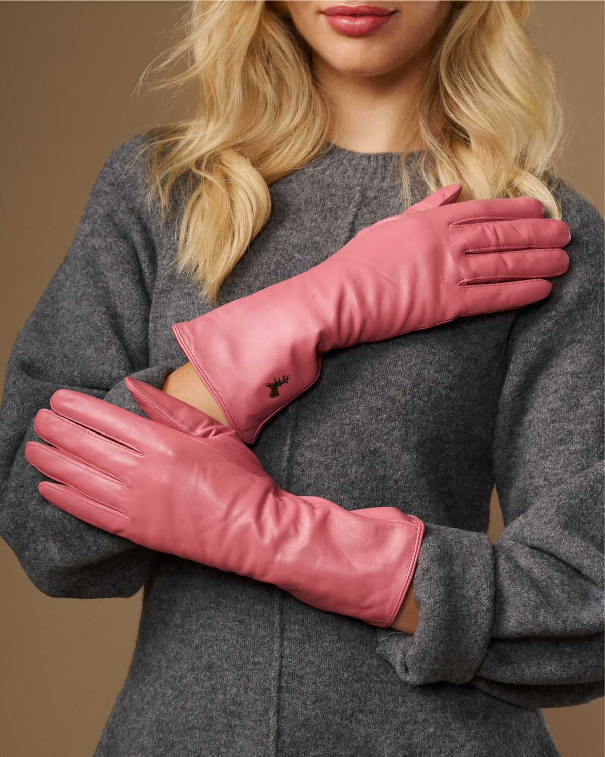 Pink leather gloves with long cuffs and stitched back, touchscreen fingertip panel