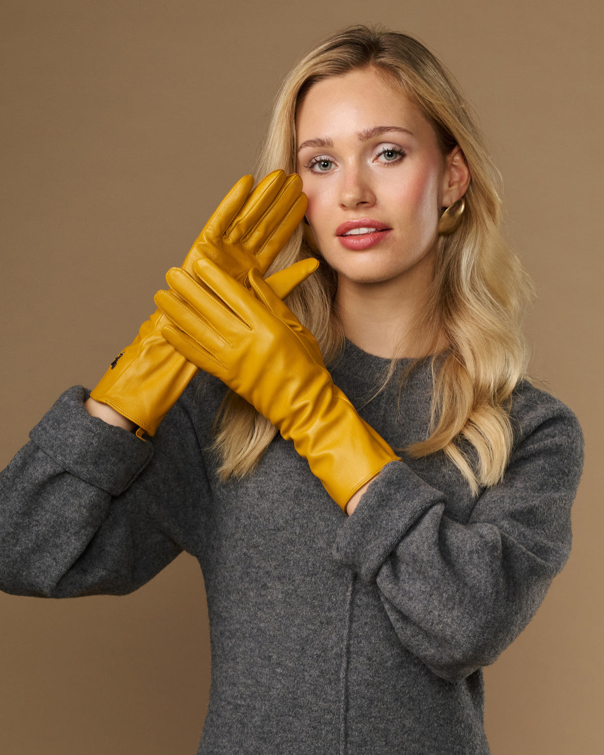 Yellow extra-long leather gloves with cashmere lining, logo on cuff, touchscreen fingertips