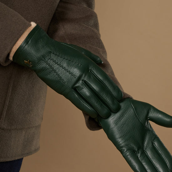 Men's dark green leather gloves with close-up finger seams and textured palm
