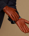 Men's cognac leather gloves, hand and cuff view with blue lambswool lining