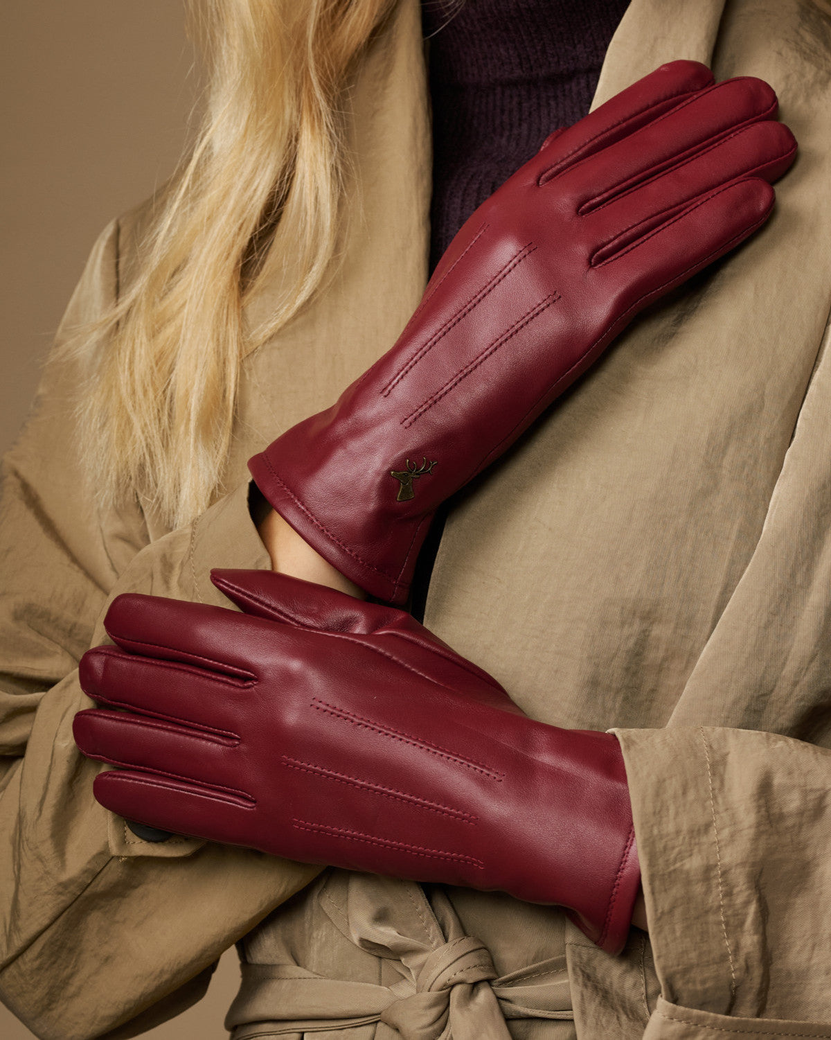 Bordeaux leather gloves with stitched finger panels and fleece-lined cuffs