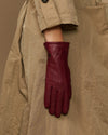 Bordeaux leather gloves with close-up fleece-lined cuff and stitched seams