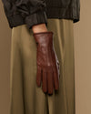 Single cognac brown leather glove with warm fleece lining and long cuff