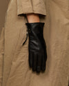 Black lambskin leather glove with side zipper, hanging display