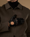 Black touchscreen leather gloves folded with palm panel and stud details