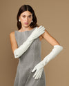 White elbow-length leather gloves with smooth finish and fitted finger shape