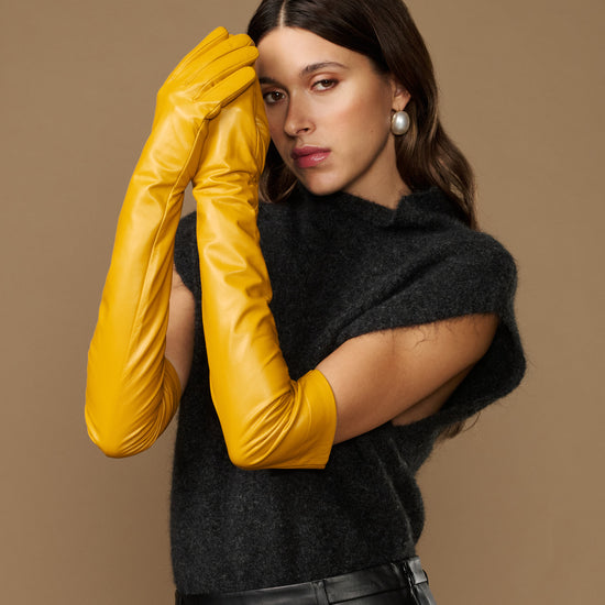 Yellow lambskin leather opera glove, long fitted sleeve with soft sheen